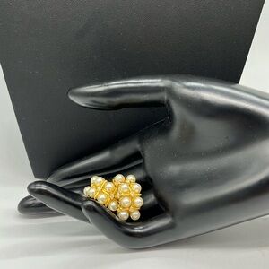 Signed Nolan Miller gold tone faux pearl and crystal open hoop earrings